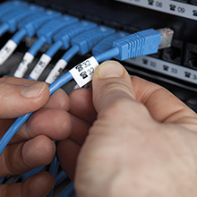 Rhino labels wrapped around blue cables