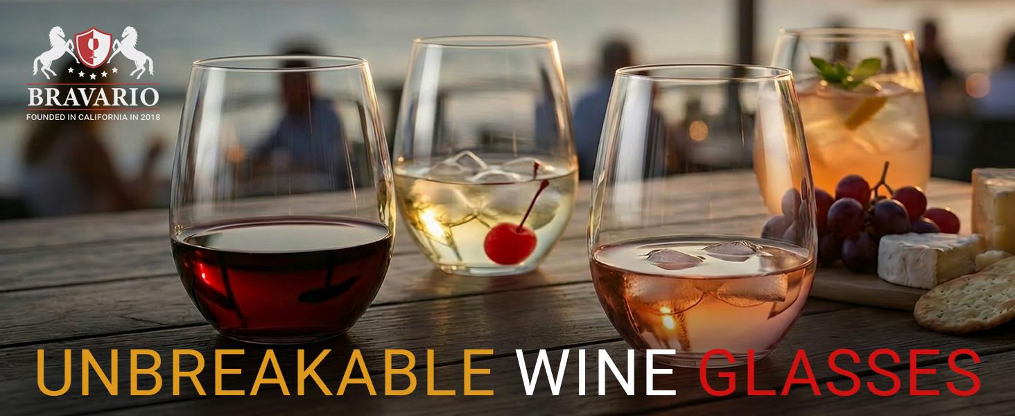Red and white wine in unbreakable stemless wine glasses on a patio table.