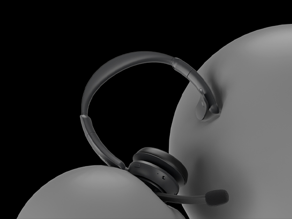 Close-up silhouette view of wireless headset or headphones against gray background.
