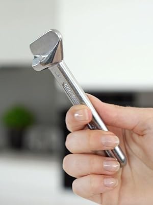 Person holding up metal JarKey