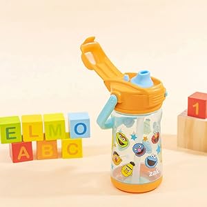 Kids Sesame Street plastic water bottle with open cover showing silicone spout