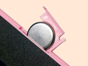 the pink phone case has a black metal frame and a black metal frame.
