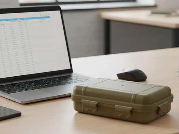 Compact case on office desk with laptop and coffee