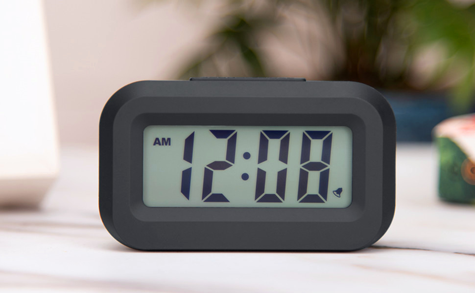 mini digital alarm clock on the desk