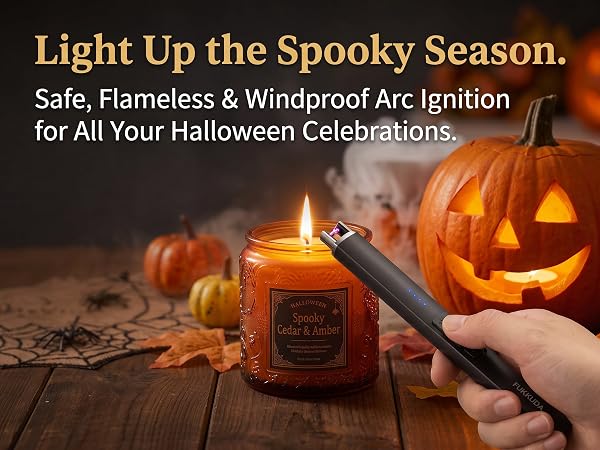 Hand holding a FUKKUDA electric arc lighter to ignite a candle inside a carved Halloween pumpkin