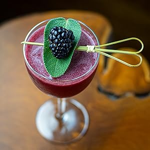 Dublin Lobby cocktail with blackberry and sage garnish