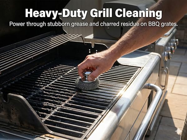 Stainless steel scouring pad with handle removing grease from BBQ grill grates