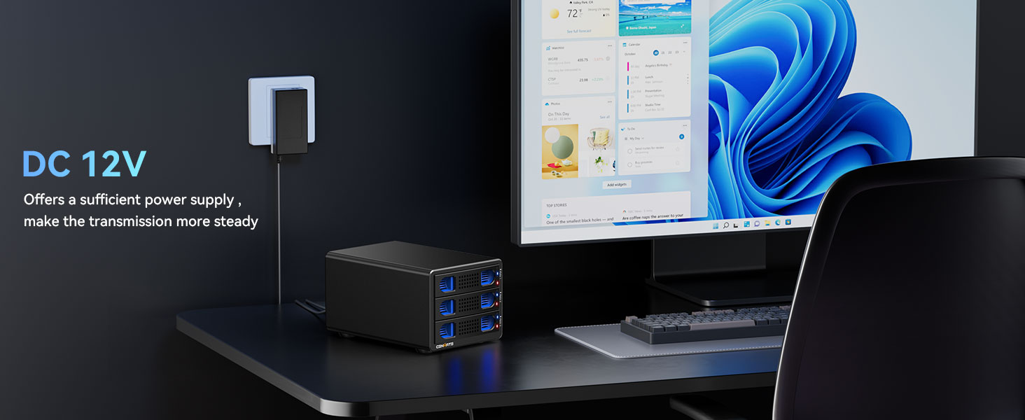 a desktop computer with blue lights on it next to a monitor.