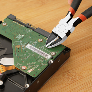 a pair of pliers remove the motherboard from the hard drive.