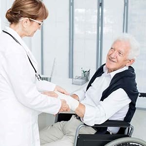 A doctor providing first aid to an elderly man