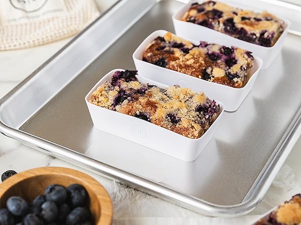 Designer white silicone baking cups with baked blueberry crumble