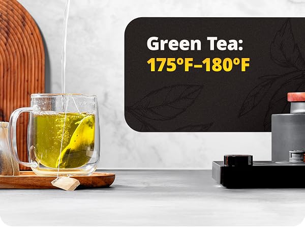 water falling into cup with teabag making green tea
