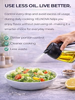 Black and clear glass oil dispenser filled with olive oil placed on a wooden