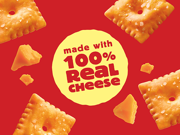 Original Cheez-It crackers and scattered on a red background, Made with 100% Real Cheese