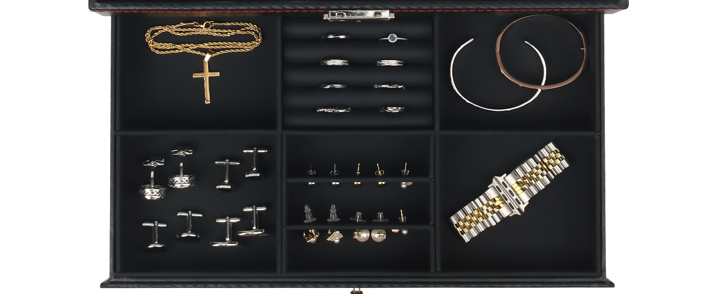 Jewelry organizer drawer with compartments displaying various accessories including necklaces, earrings, cufflinks, and a watch band. Dark wood finish with velvet-lined sections.