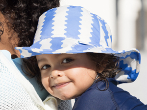 toddler boy wearing checkers Tiny Twinkle Sun Hat
