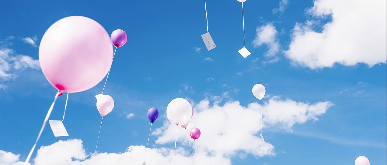 Colorful balloons floating in a blue sky with white clouds. Small white cards attached to balloon strings.