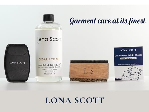 Text reads "Garment care at its finest" and "LONA SCOTT". Product collection includes black fabric care item, clear garment care solution bottle, tan leather wallet with "L.S" initials, and instruction card on light background.