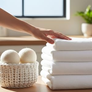 Series showing white woven or knitted storage baskets being demonstrated with items being placed inside, displayed on light surface.