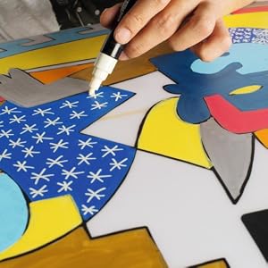 drawing stars with a white posca marker