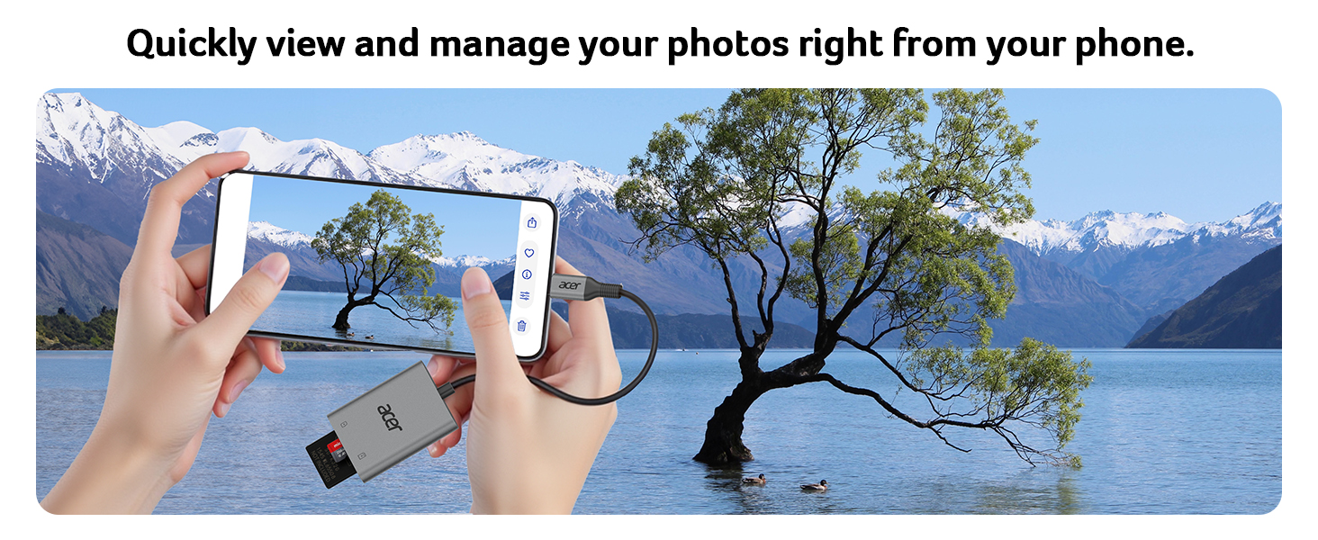 Hands holding smartphone, taking photo of lake with tree. USB device connected, suggesting easy photo transfer and management on mobile device.