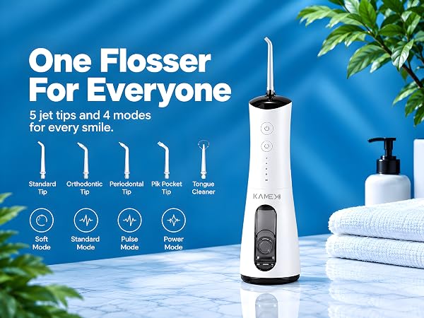 A white KAMEX Cordless Water Flosser featuring 5 interchangeable jet tips and four operating modes.