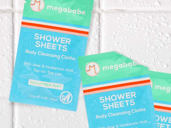 Shower sheets on tiled bathroom background.