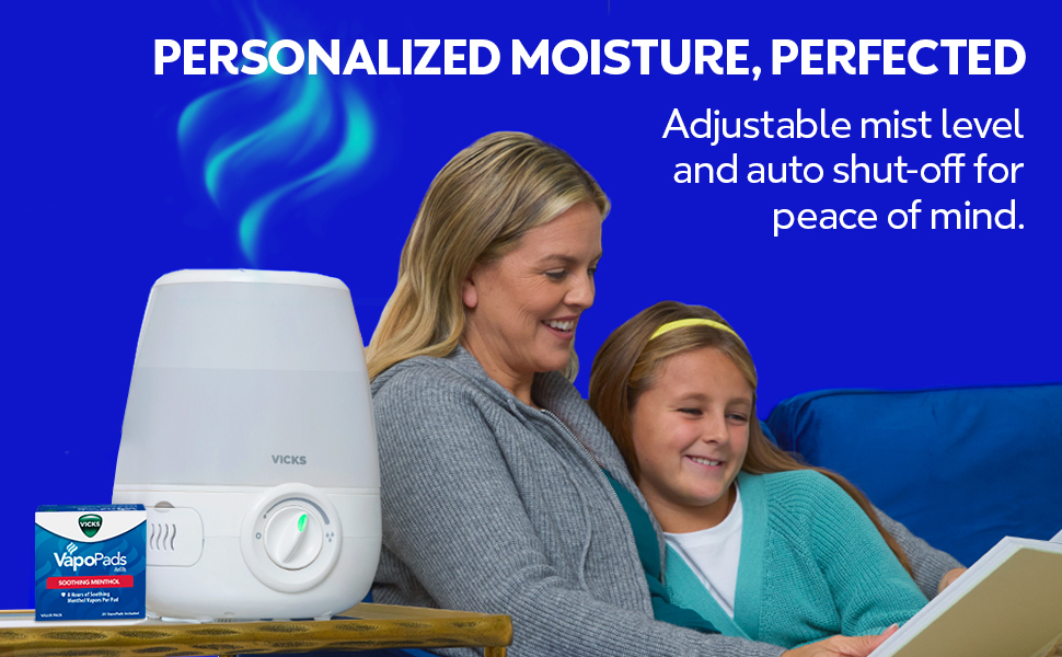 Mother reading book to daughter next to the Vicks Humidifier V4600