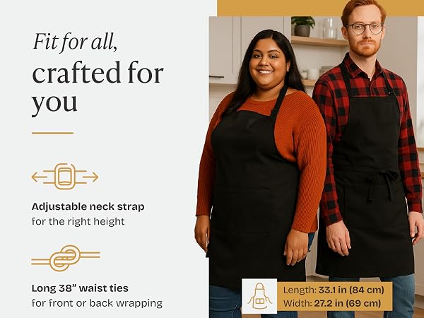 Ethnically diverse man and woman wearing the black Will Well apron to show size versatility.