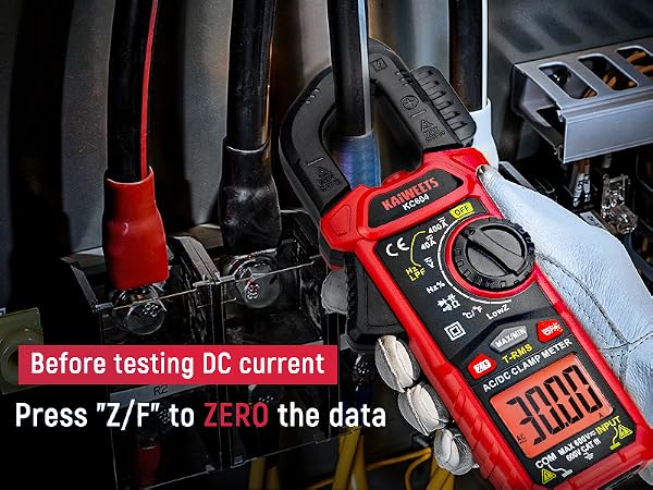 Red digital multimeter in use, measuring DC current. Text instructs to press 'Z/F' to zero the data before testing.
