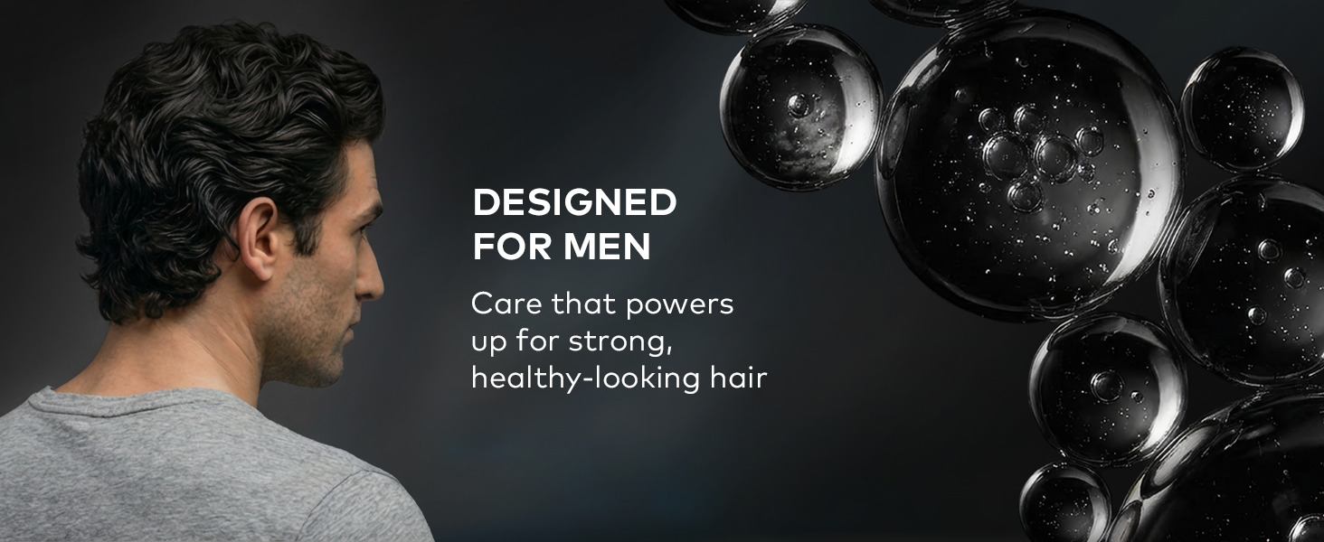 Text reads: Designed for men. A man with curly hair on a dark backdrop.