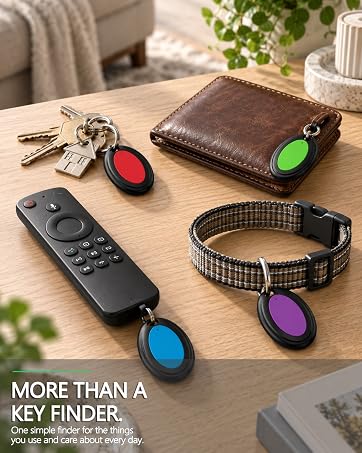 Text reads: 'MORE THAN A KEY FINDER.' Collection of colorful tracking tags with keychains in red, blue, and purple displayed with remote control and checkered fabric collar on wooden surface.