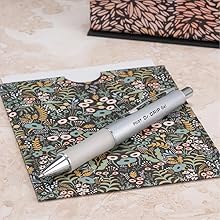 Photo shows Dr. Grip Limited pen resting on a greeting card