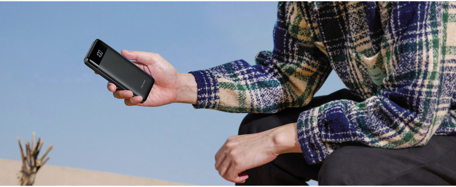 a person holding a cell phone in their hand.