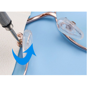 Unscrew the screws on the nose pads