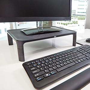 close up of monitor stand with keyboard and monitor