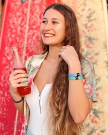 girl drinking soda with bands