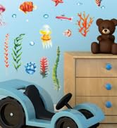 Decorative wall decals featuring cartoon bears and nature elements against light blue background near furniture.