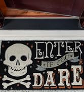 Coir doormat placed in front of a front door with the text Boo! in gothic font