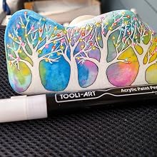 a painting of a tree with a white marker.