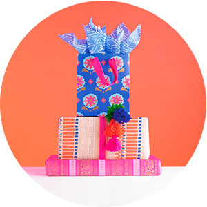 Blue and pink gift bag with coordinating wrapping paper for birthdays, baby showers and parties