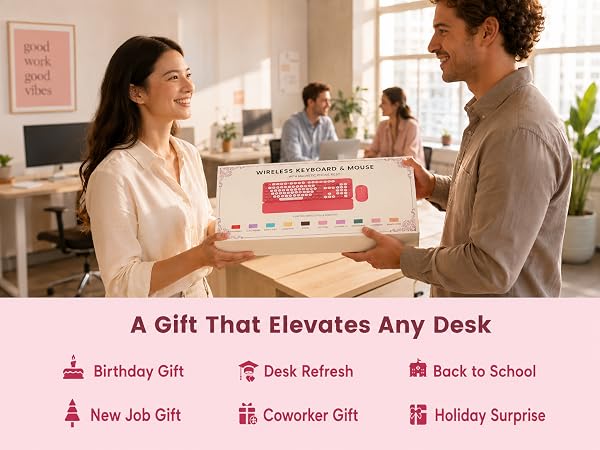 Boxed wireless keyboard and mouse set being given as a desk gift in a bright office scene.