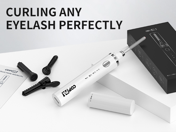 Electric eyelash curler with detachable heads and charging base. White cylindrical device with multiple attachments shown alongside product box and instruction manual.