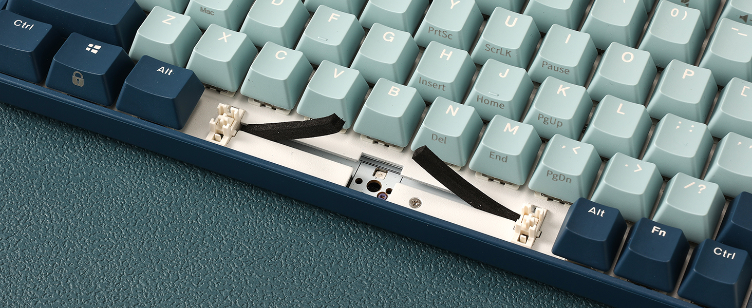 Silencer foam under the space bar, reducing noise and protecting the kb from dust.