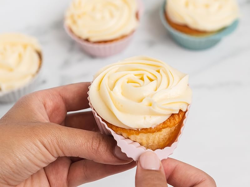 Dusty rose and dusty blue silicone baking cups with a cupcake