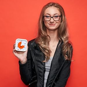 Teenage girl holding Time Timer MOD 30 Minute visual timer.