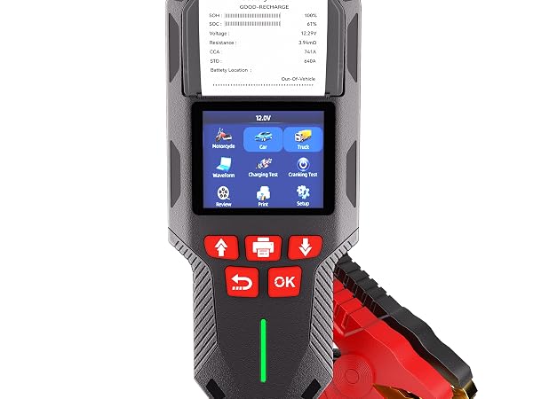 Automotive diagnostic scanner device with LCD screen displaying blue menu icons, black housing with red control buttons labeled 'OK', and red diagnostic connector attachment. Device appears to be a professional vehicle diagnostic tool.