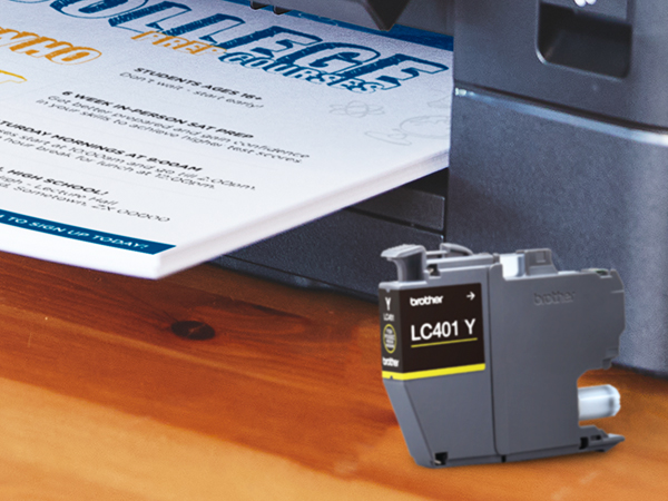 LC401 ink cartridge in front of Brother printer