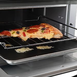 grill mat being used to catch all food drippings