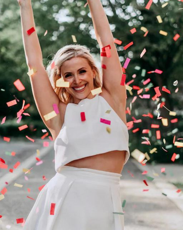 girl dancing confetti cannon multicolor